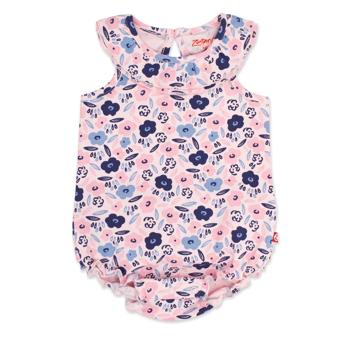A short-sleeved baby romper in pink with a floral pattern, including blue blossoms and green leaves, designed for a girl.