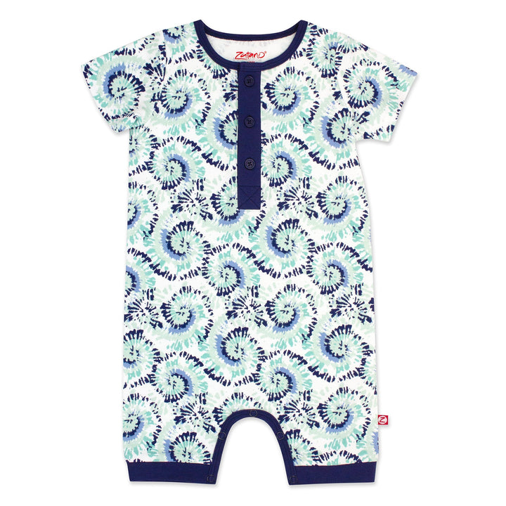 A short-sleeved henley bodysuit with a tie-dye pattern in shades of blue and white, featuring a front placket with three buttons and a snap opening between the legs.