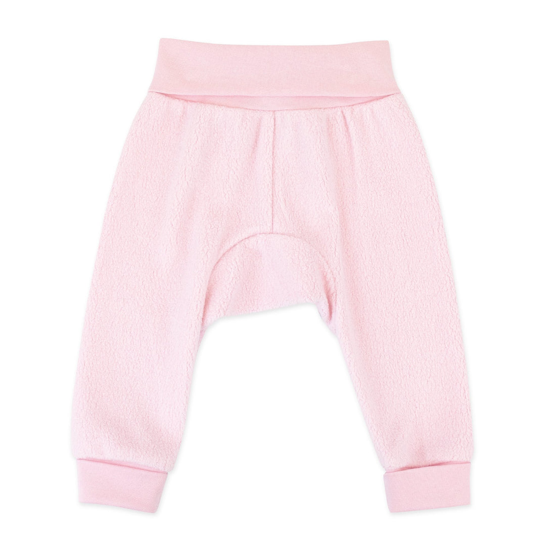 A pair of baby pink fleece cuff pants with a wide rib cotton waistband and cuffs.