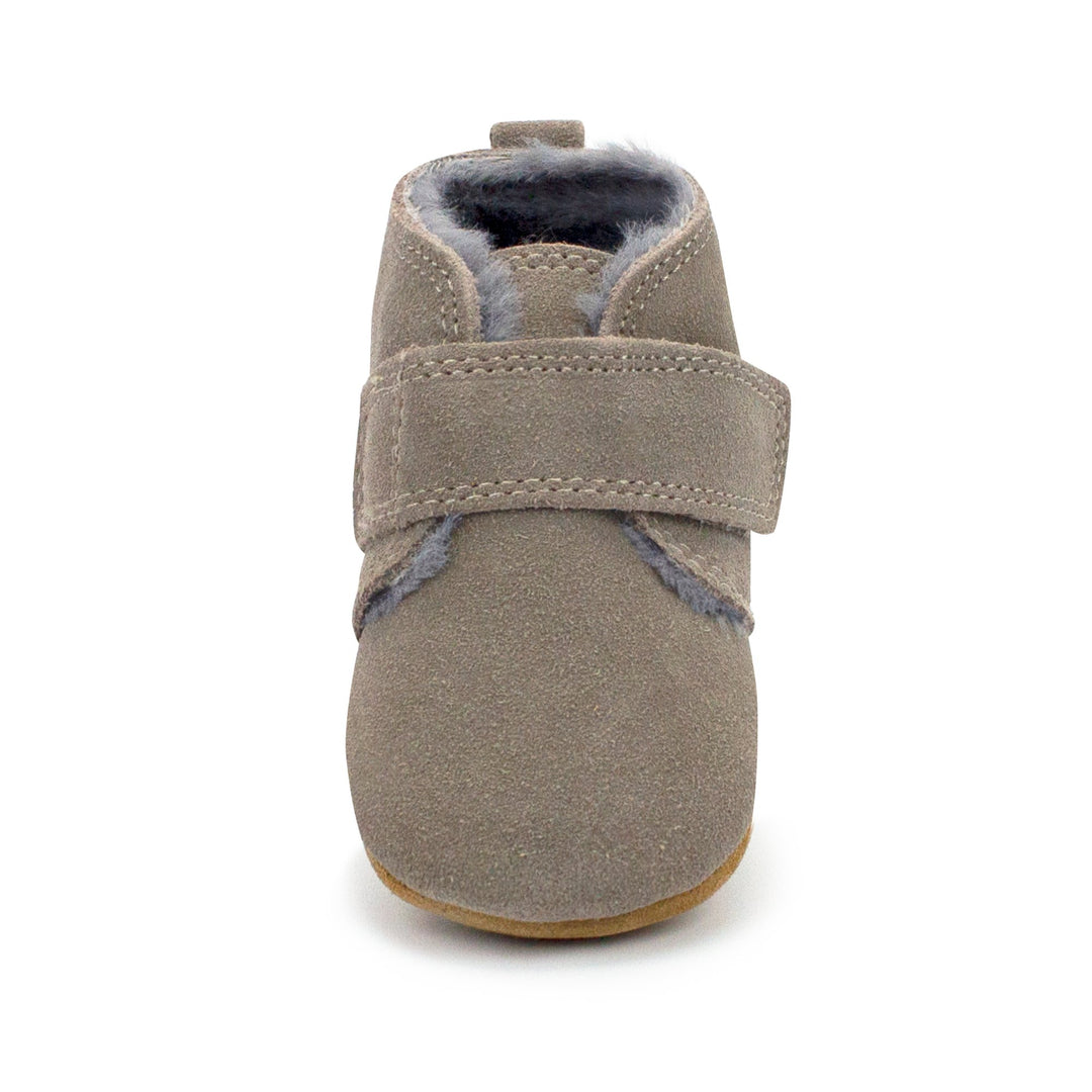 Gray leather baby shoes with furry lining and a Velcro strap across the front.