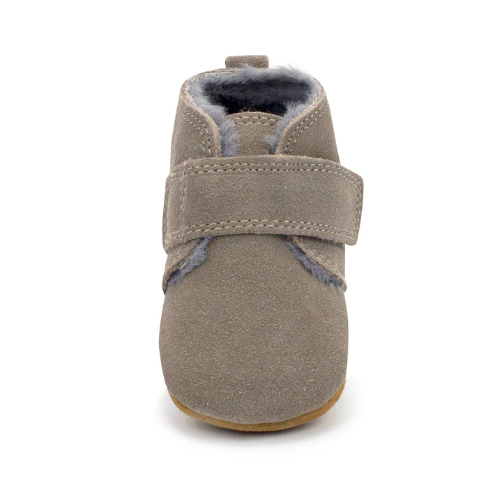 Gray leather baby shoes with furry lining and a Velcro strap across the front.