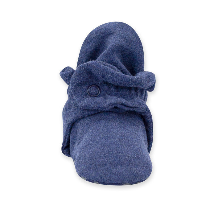 Navy-colored organic cotton baby booties with rubber grippers on the sole and a two-snap secure fit.