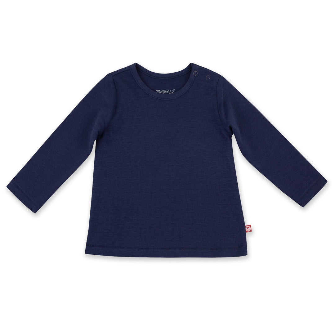 A long sleeve navy blue baby girl top laid flat on a white background.