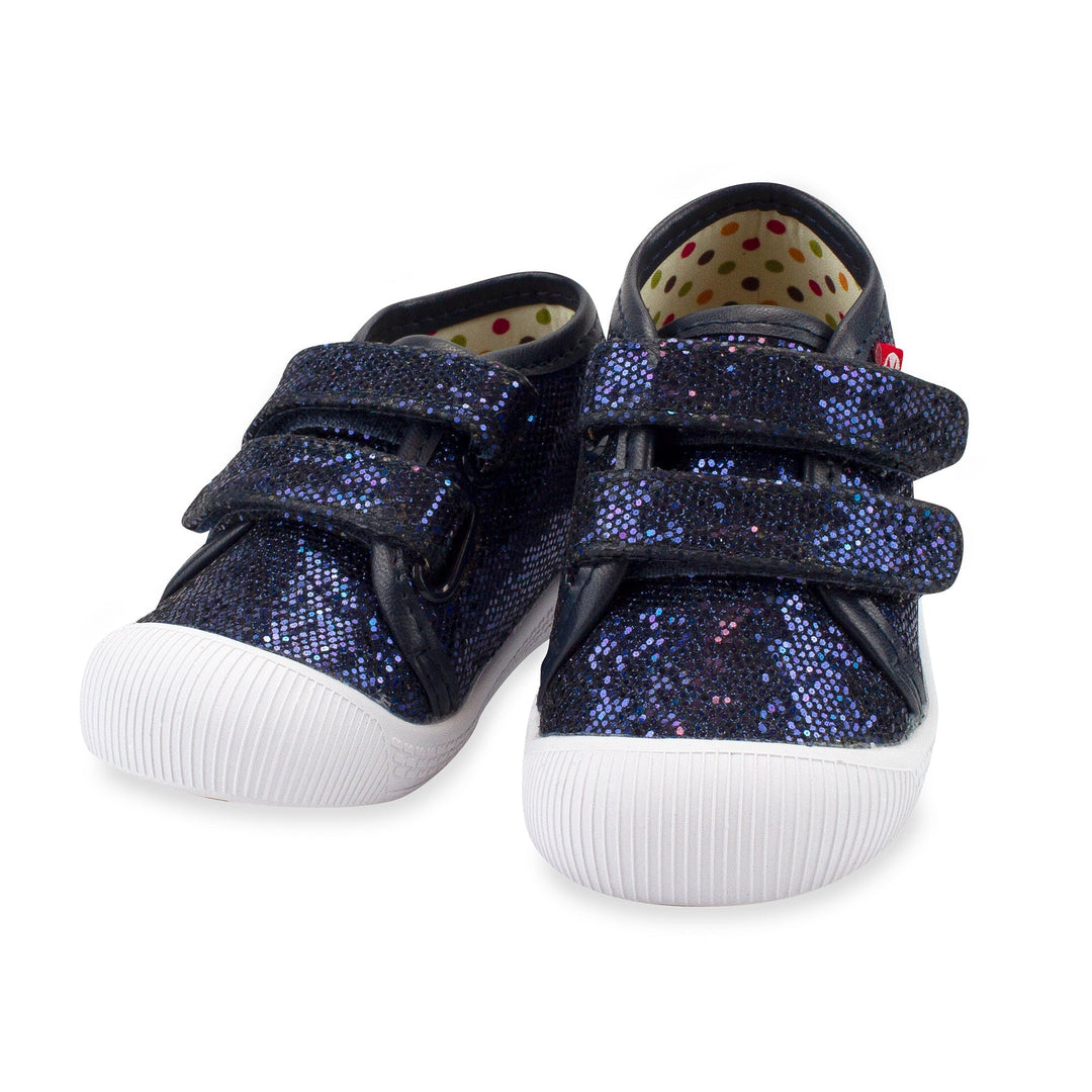 A pair of navy sparkle baby shoes with a hook & loop strap and a flexible rubber outsole, displayed on a white background.