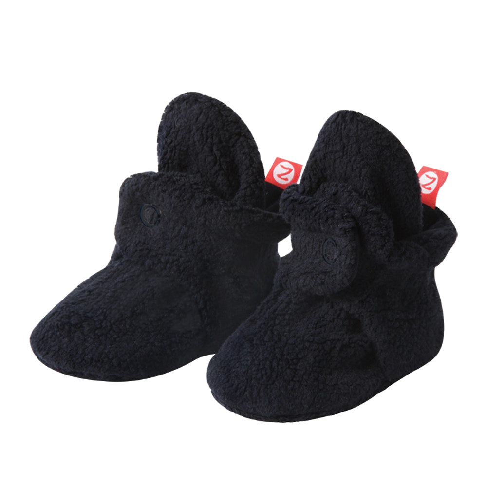 Set of fleece baby booties in black, gray, and olive colors.