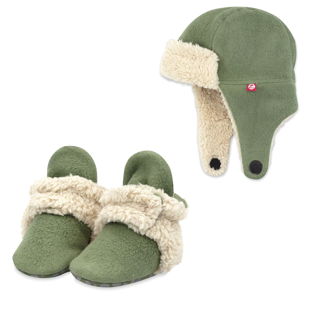 A set of olive green cozie furry booties and trapper hat for babies