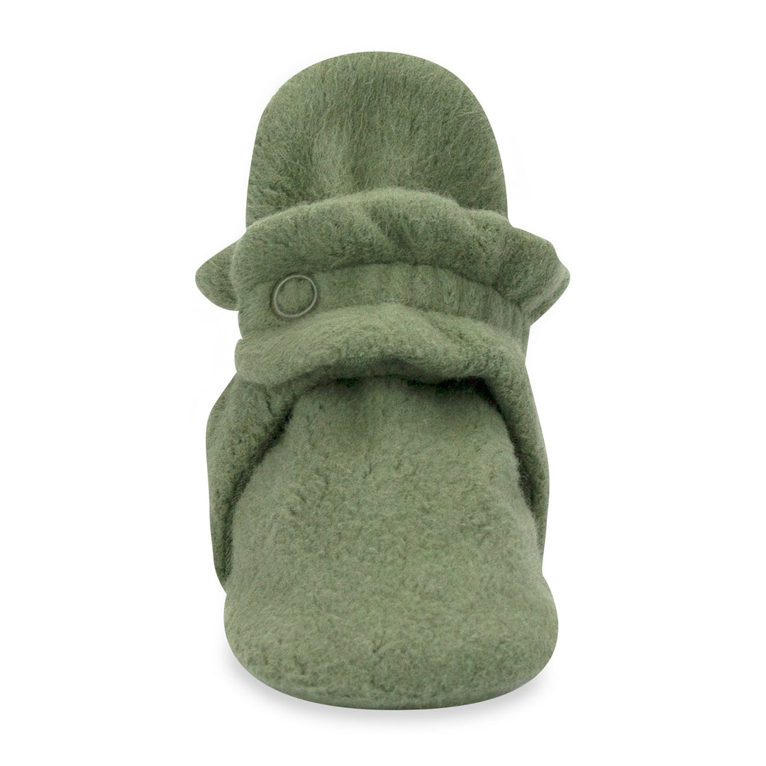 Green baby booties with adjustable snaps on the top made from organic cotton.