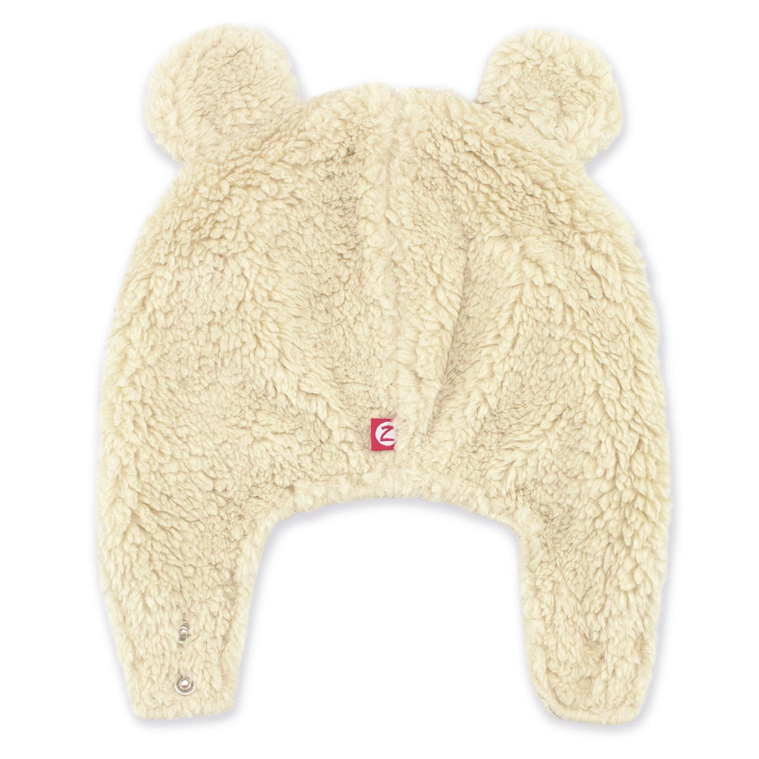 Beige furry bear hat with earflaps and bear ears, designed for babies.