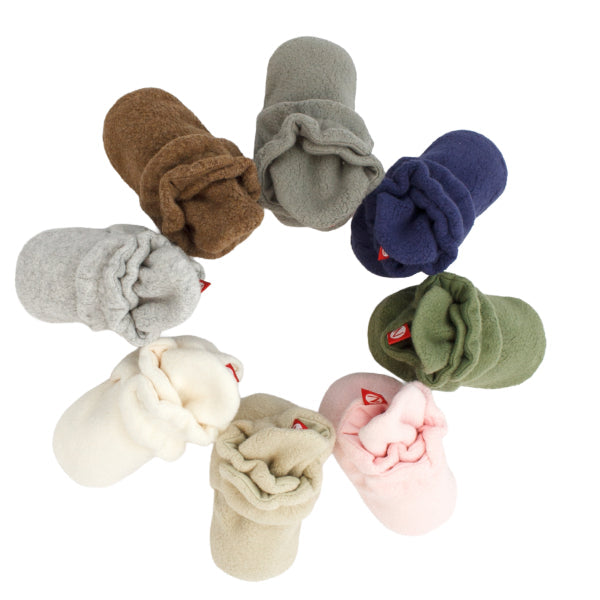Close-up of Zutano booties in organic cotton and fleece, showing fabric texture and secure snap design