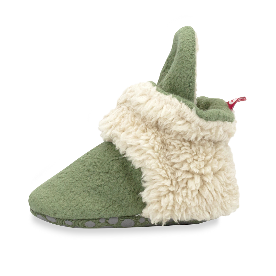 Baby booties with furry white detailing on the heel and strap.