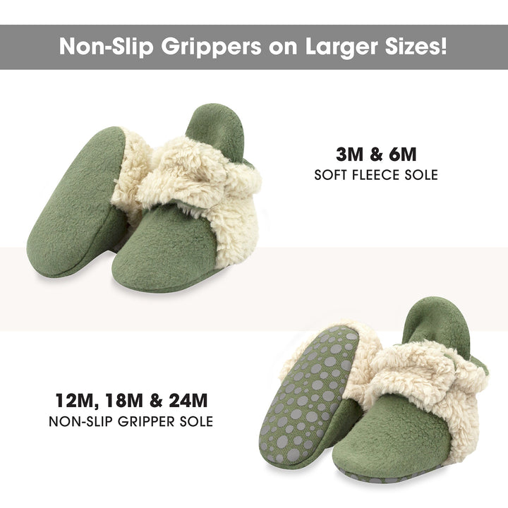 Green baby booties with furry white detailing on the heel and strap.