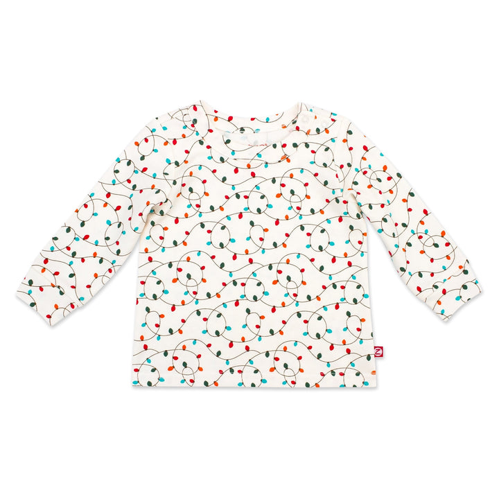 A long sleeve crewneck baby top with a multicolor geometric pattern, predominantly white with red, green, and blue triangles.