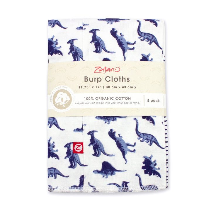 A packaged set of organic cotton burp cloths with a dinosaur print design.