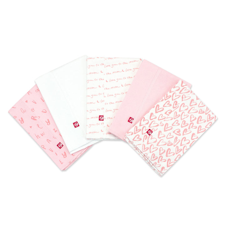 Set of five organic cotton burp cloths with a pink and white heart print.