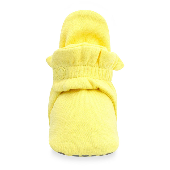 Yellow organic cotton baby booties with gripper soles and a popcorn print by Zutano Baby.
