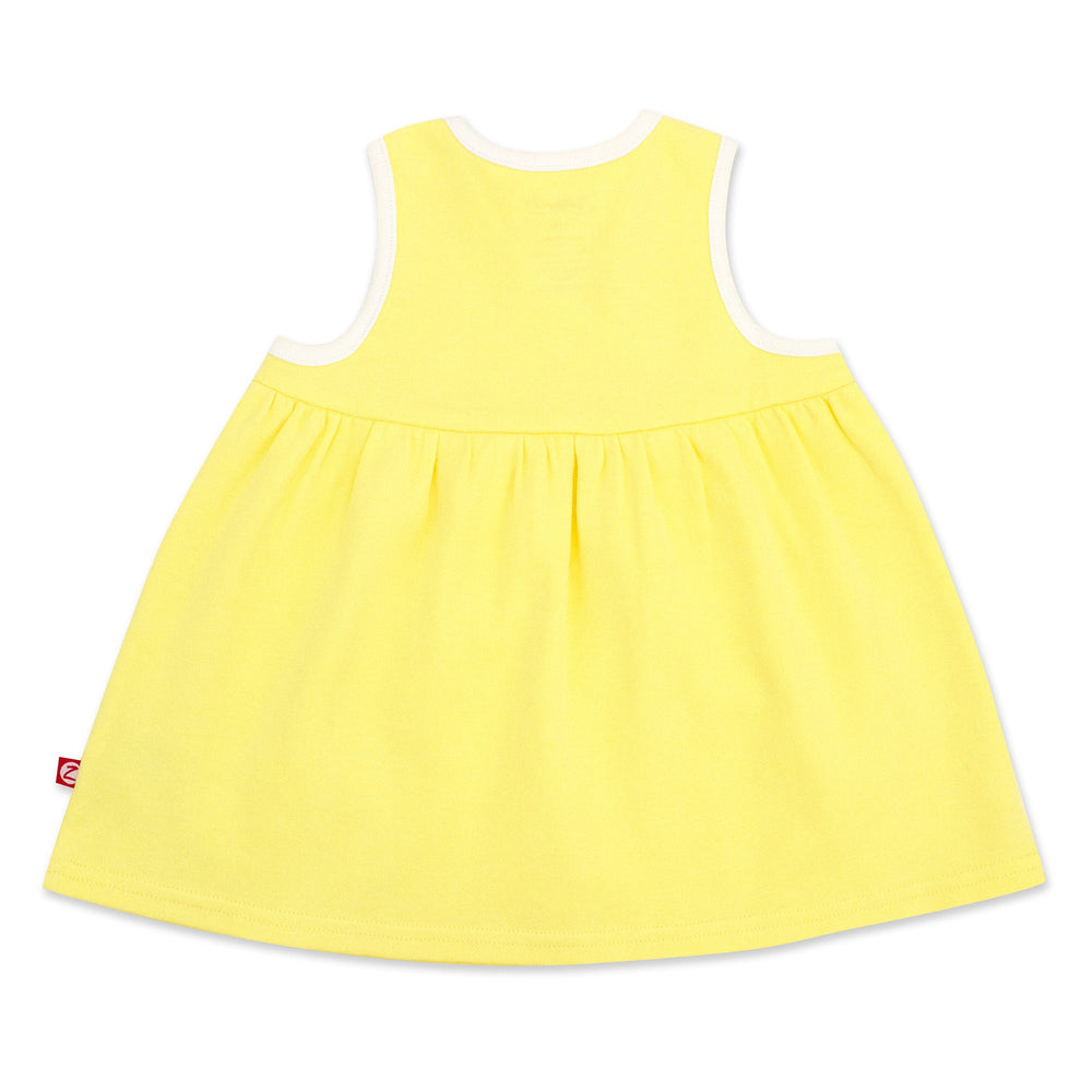 A sleeveless yellow sundress with faux wrap styling, made from organic cotton.