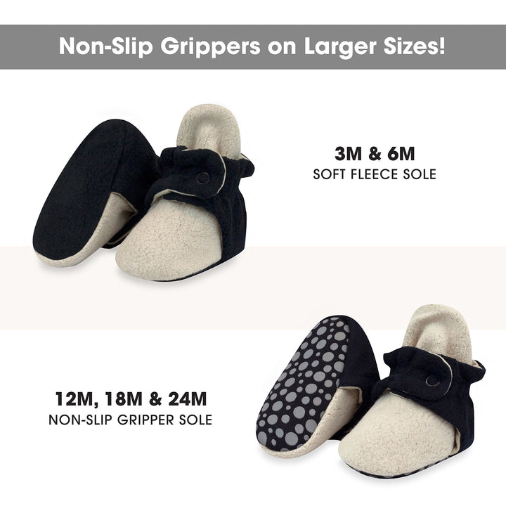 Baby booties in color block design with a fleece exterior and appear to have a soft, plush texture.