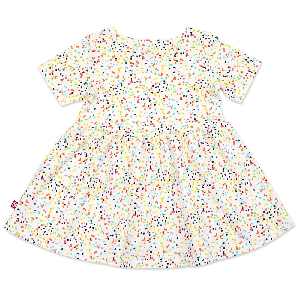 A short sleeve baby dress with a confetti print 