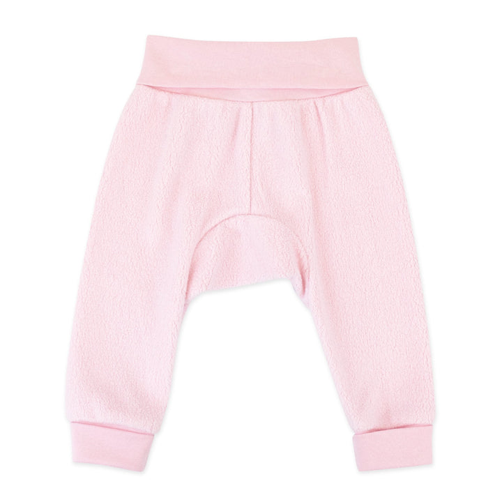 A pair of baby pink fleece cuff pants with a wide rib cotton waistband and cuffs.