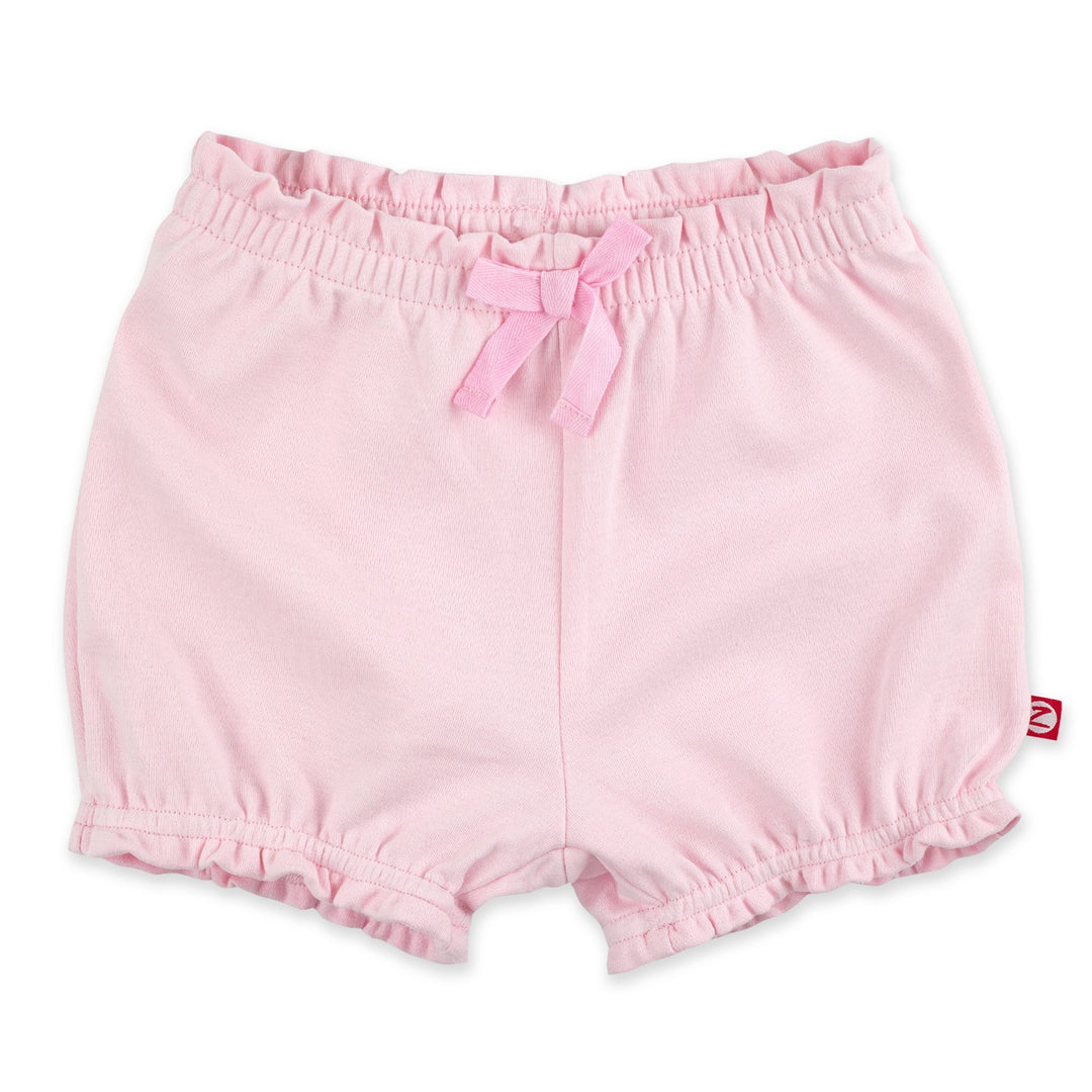 Baby pink organic cotton ruffle shorts with a decorative bow at the front
