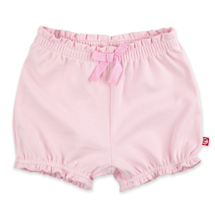 Baby pink organic cotton ruffle shorts with a decorative bow at the front