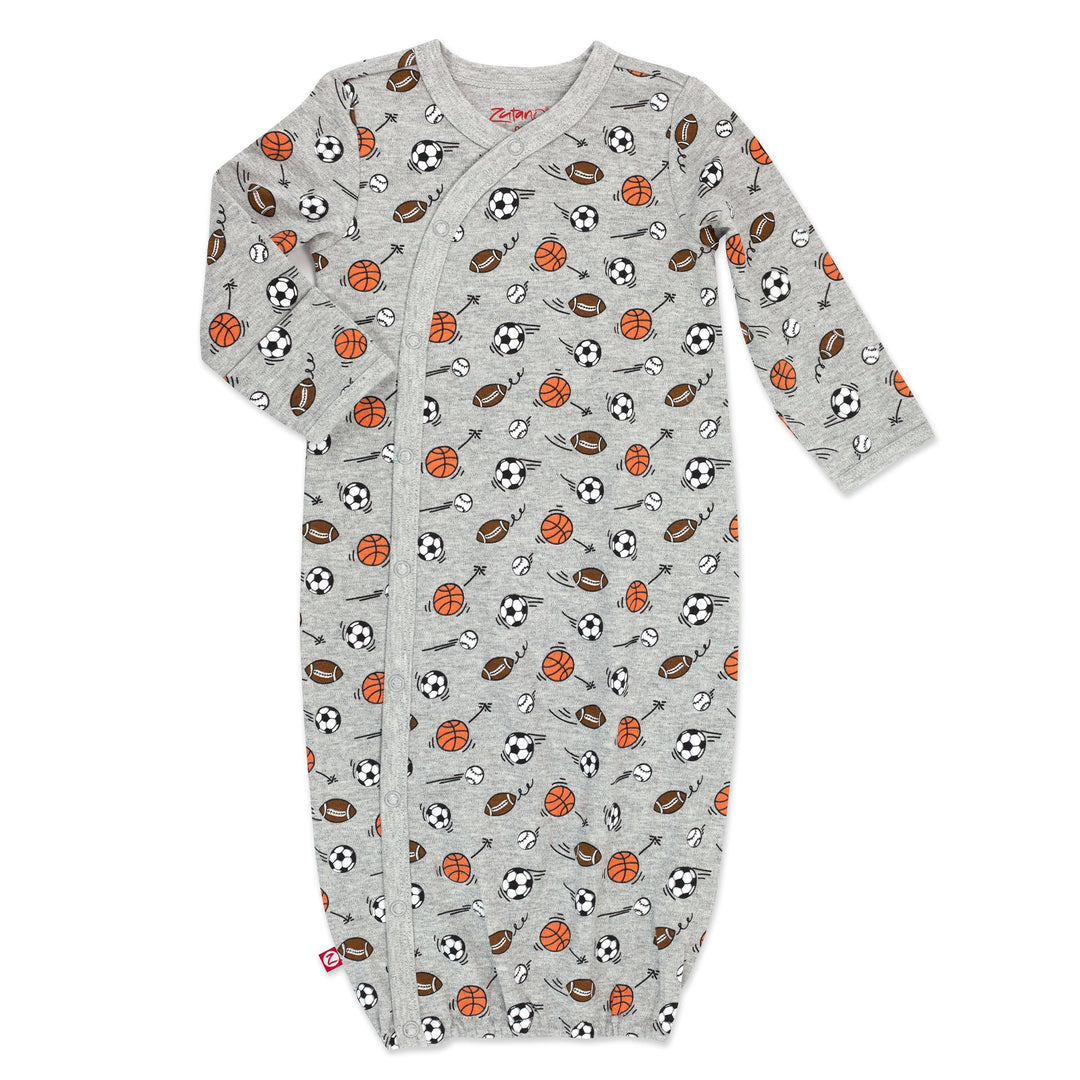 A gray and orange baby kimono gown with a sports-themed print including images of a soccer ball, basketball, and American football.