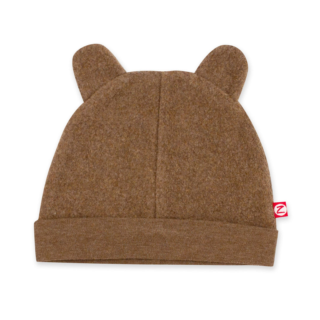A heather mocha colored fleece baby hat with ears resembling a bear's face.