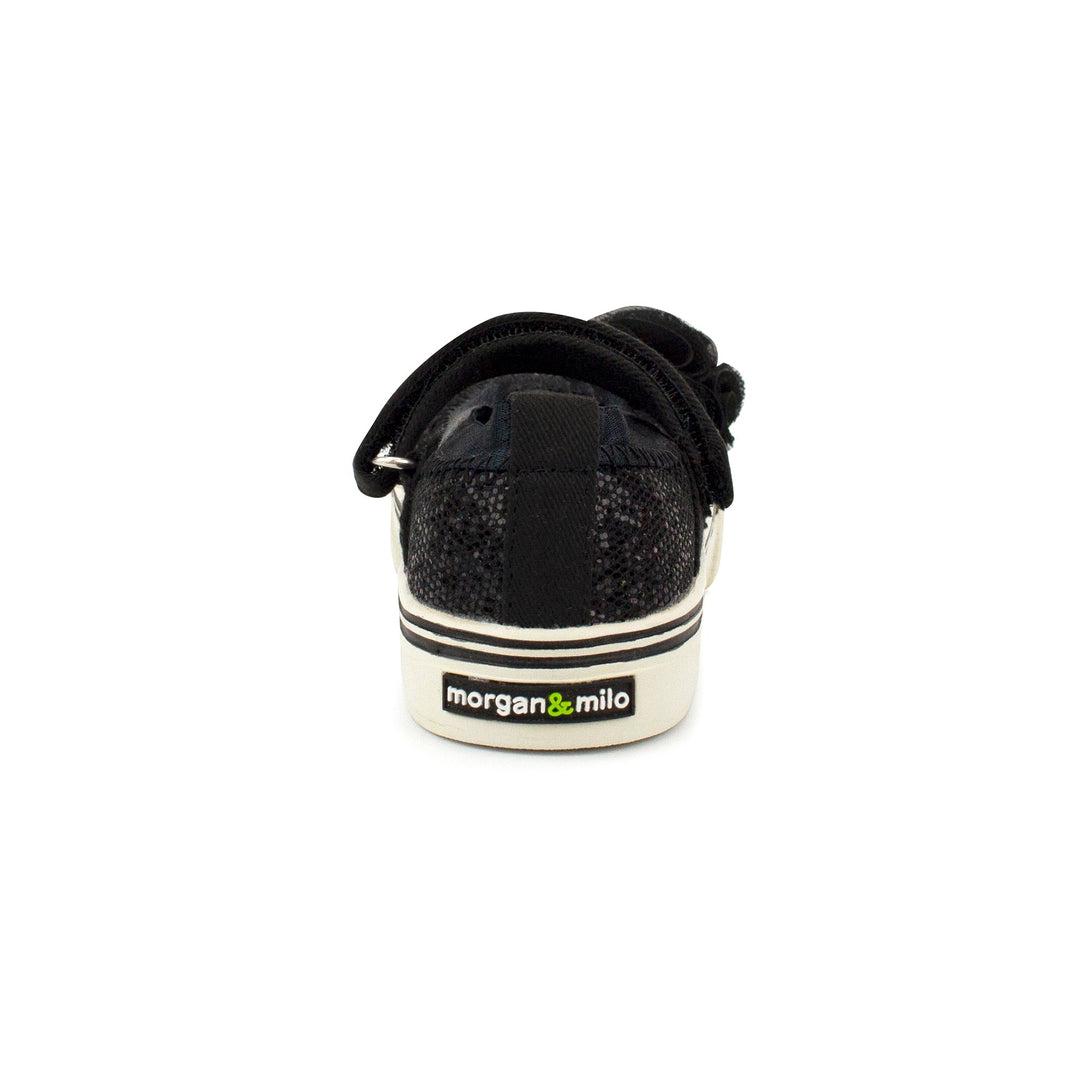 Hook & loop strap Mary Jane black shoe with a touch of added personality.