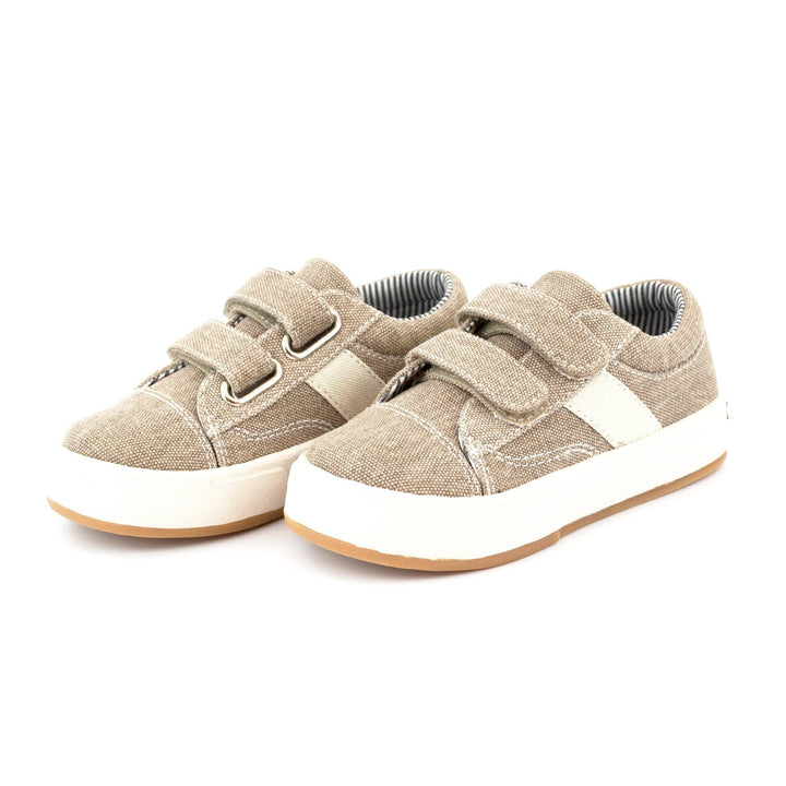 A pair of khaki Miles Double V shoes for kids with hook & loop straps and a cushioned insole.