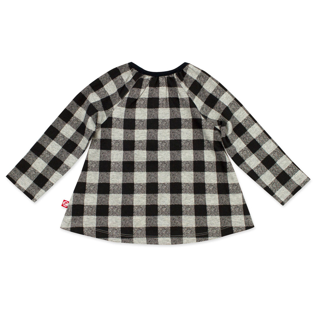Long sleeve top that has keyhole openings at the top of each shoulder, adding style and making it easy as can be to dress baby girl.