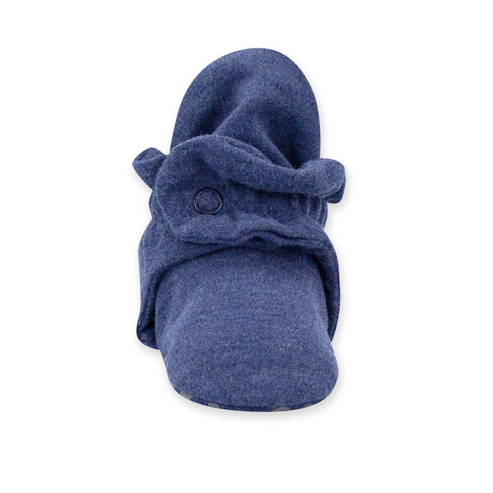 Navy-colored organic cotton baby booties with rubber grippers on the sole and a two-snap secure fit.