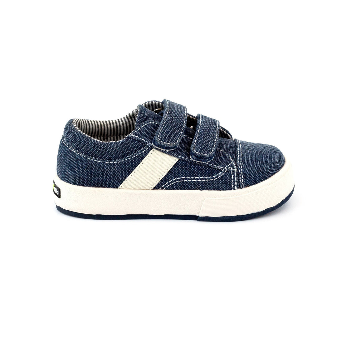 Navy children's sneakers with hook & loop straps and a durable waxed cotton canvas upper.