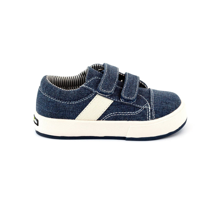 Navy children's sneakers with hook & loop straps and a durable waxed cotton canvas upper.