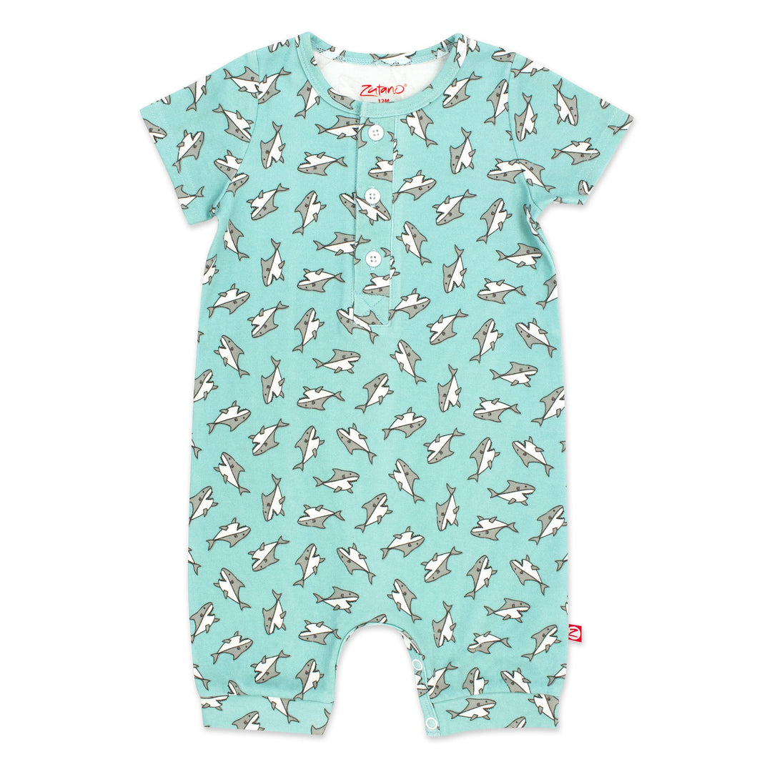 Organic cotton henley bodysuit with a Baby Sharks print in blue color, featuring short sleeves and a placket with three buttons.
