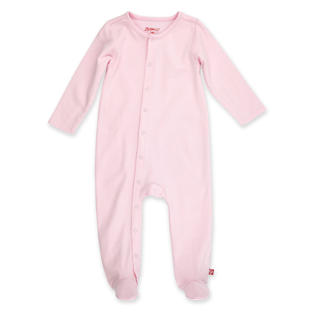 A baby pink organic cotton footie with front snaps, designed for comfort and ease of use.