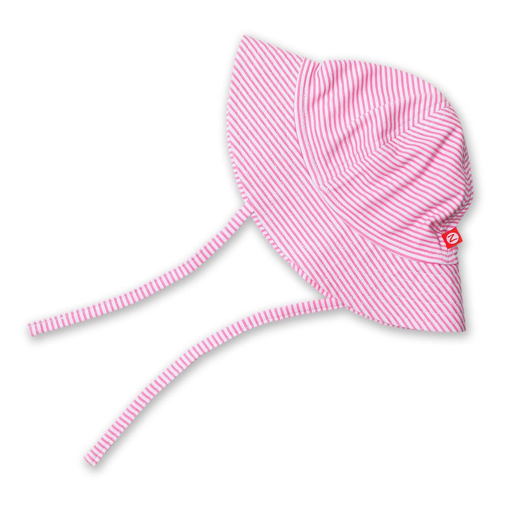 A pink candy striped sun hat with chin ties for babies.
