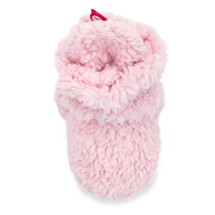 Baby booties with faux fur exterior and gripper soles, displayed against a white background.