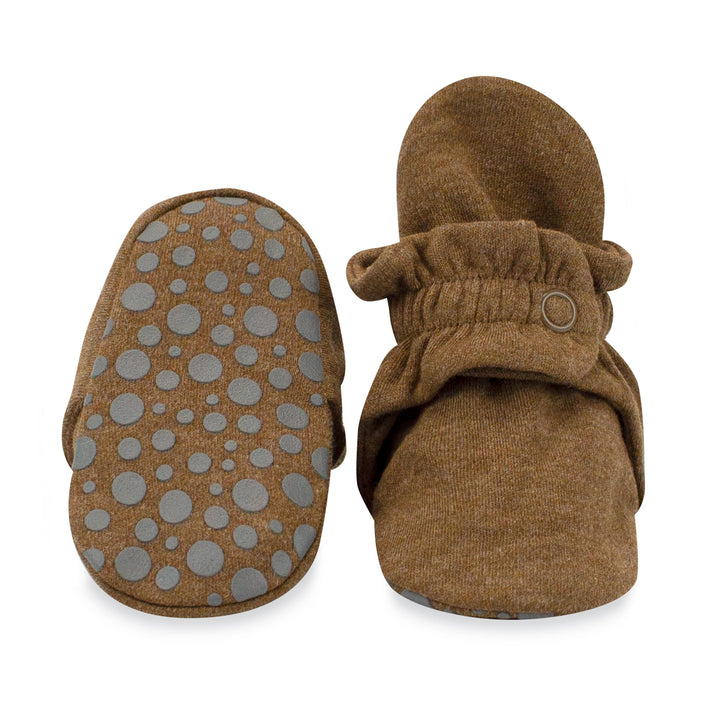 Baby booties with rubber grippers on the bottom.