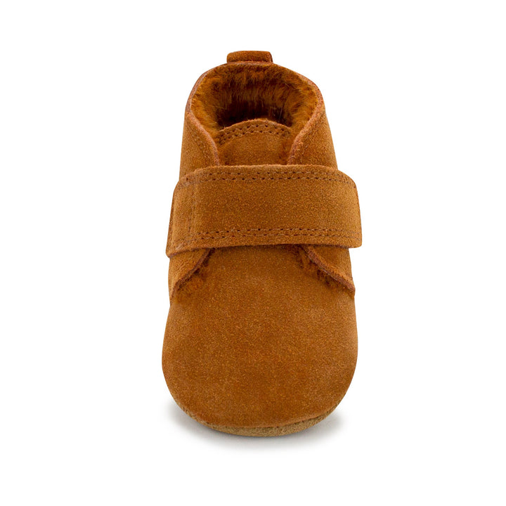 Brown baby shoes with furry lining and a Velcro strap across the front.