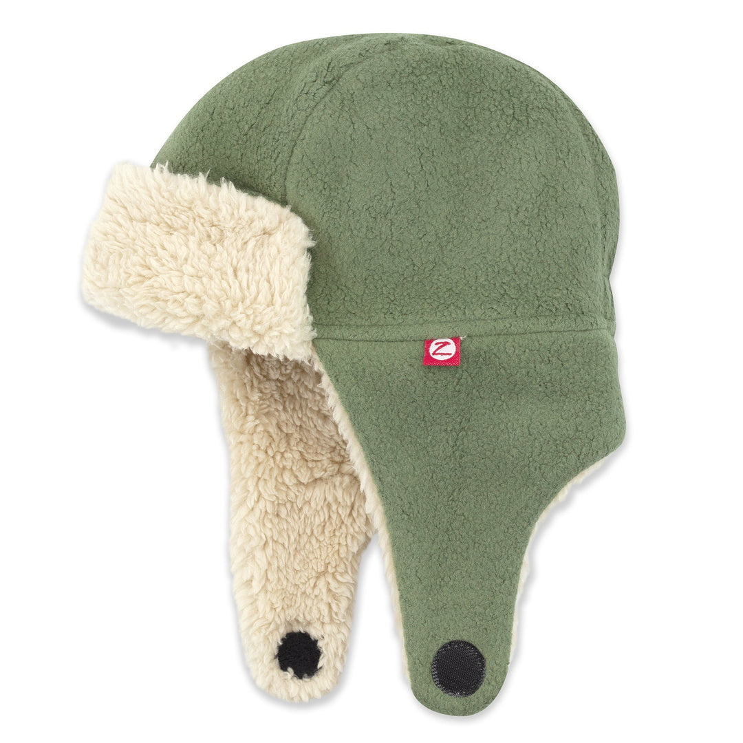 A green fleece trapper hat with a soft furry lining, ear flaps, and a chin strap.