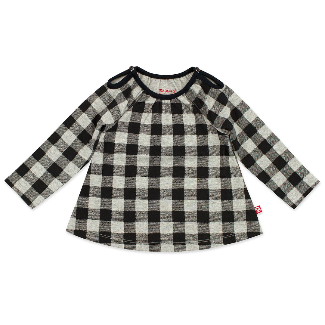 A long sleeve baby girl's top in a buffalo check print, with keyhole openings at the top of each shoulder.