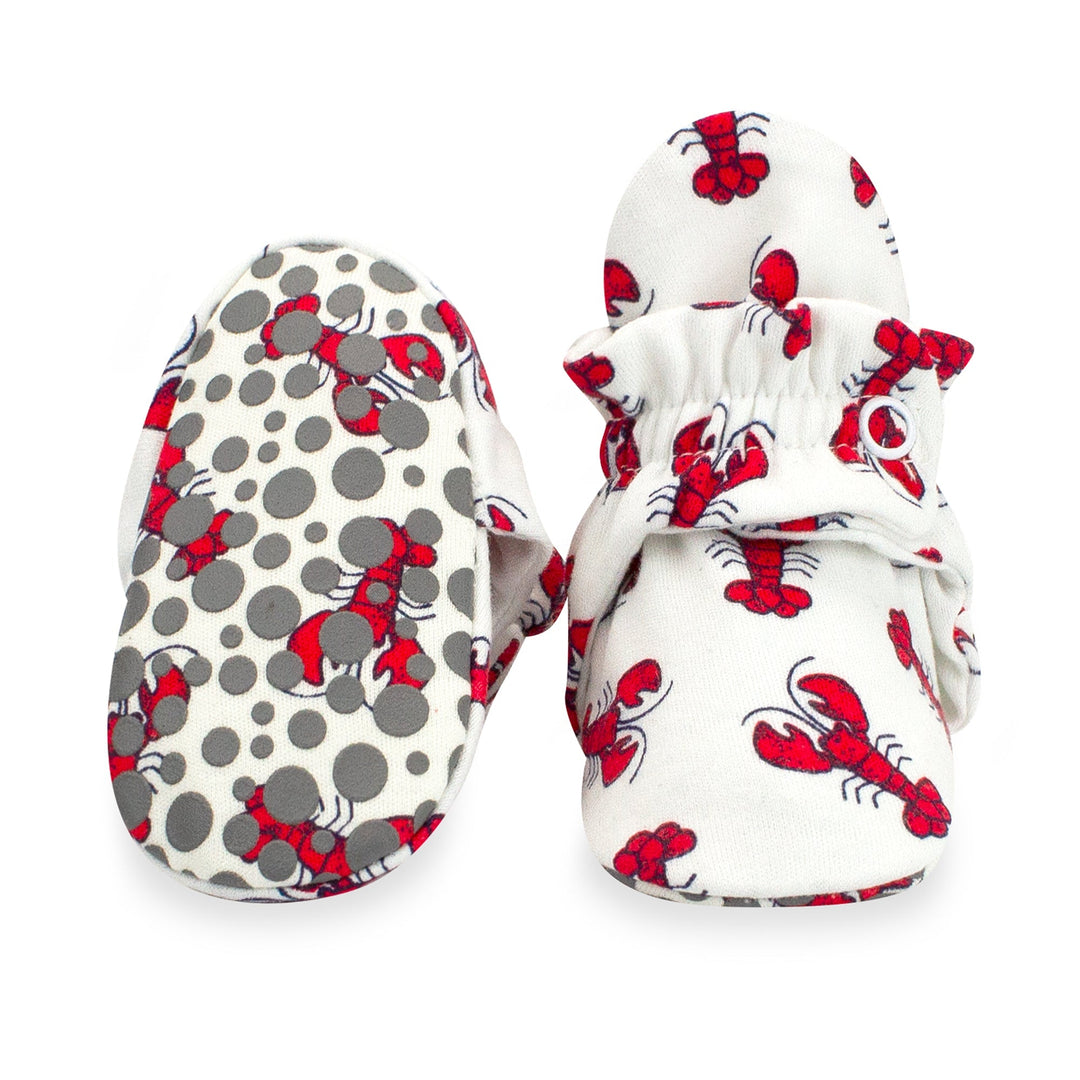 Red lobster print baby booties featuring rubber grippers on the bottom.
